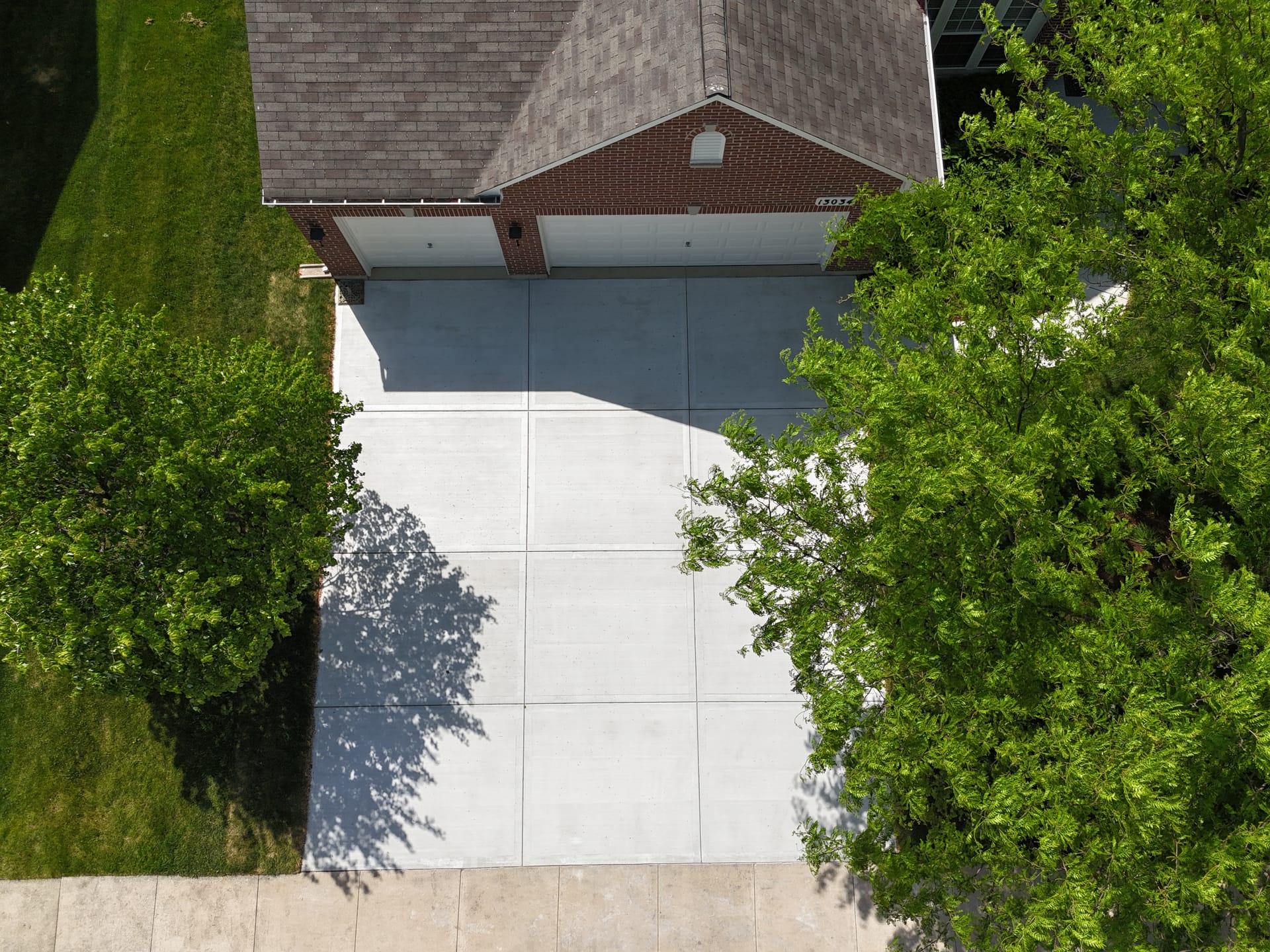 Concrete driveway vs asphalt comparison — ZBL Concrete