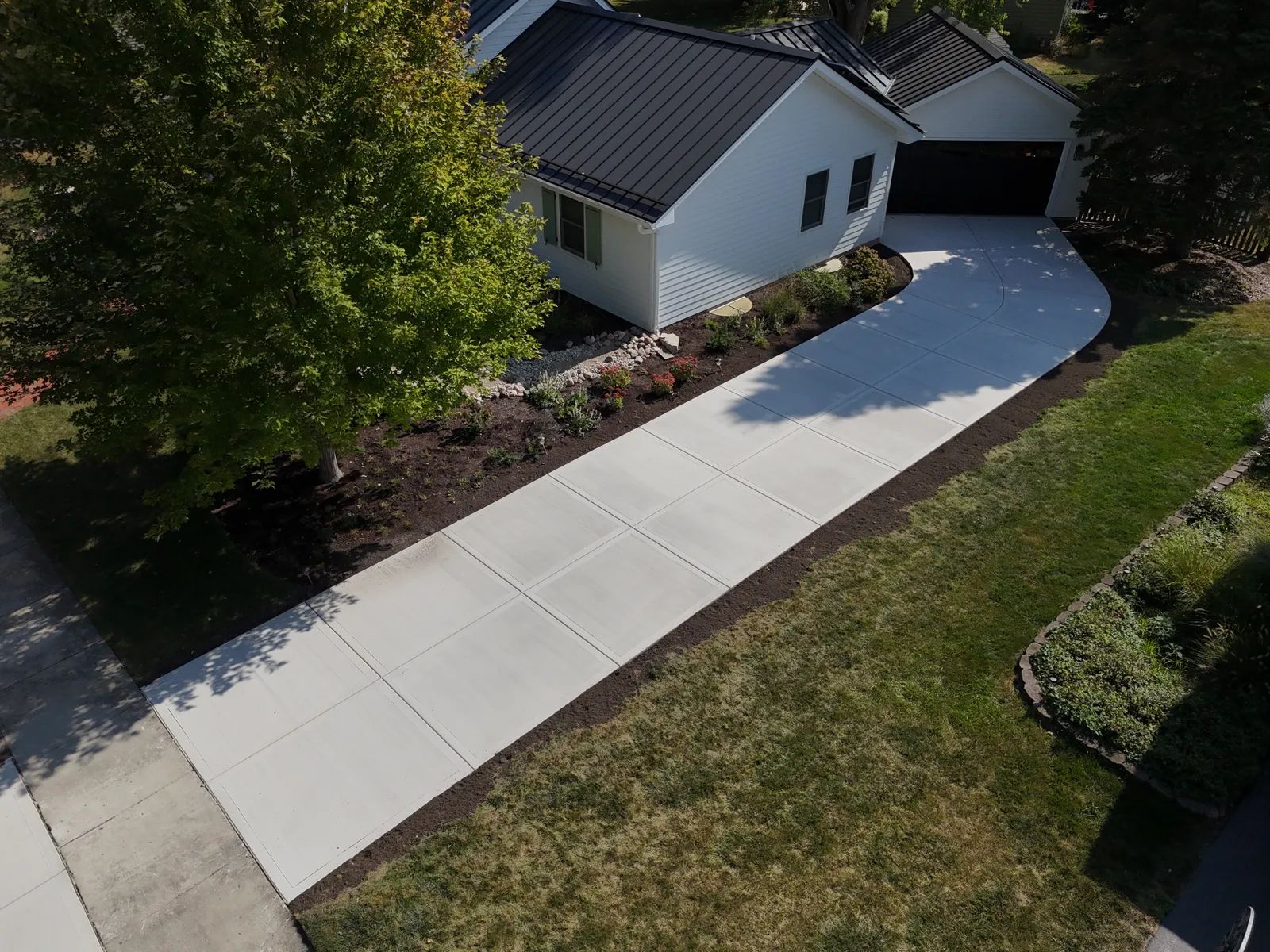 Long concrete driveway from angled perspective