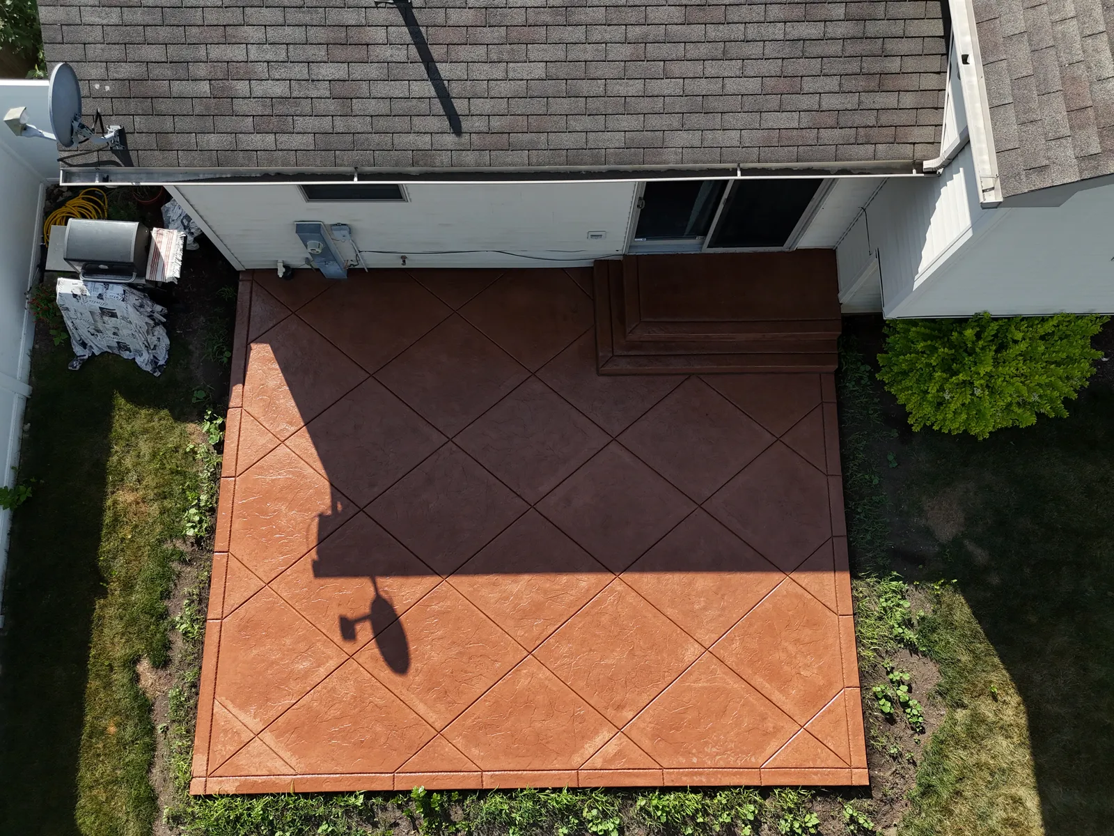 Terracotta stained concrete patio bird's-eye aerial view