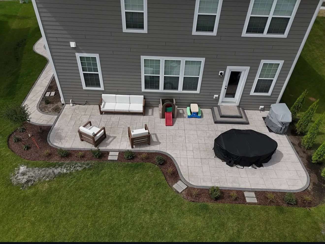 Stamped concrete patio with border by ZBL Concrete