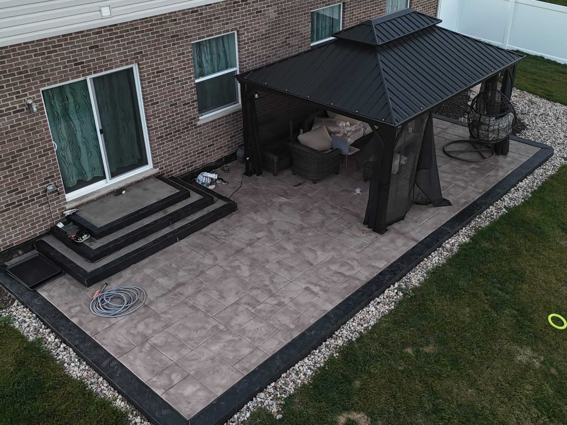 Stamped concrete patio vs pavers comparison — ZBL Concrete