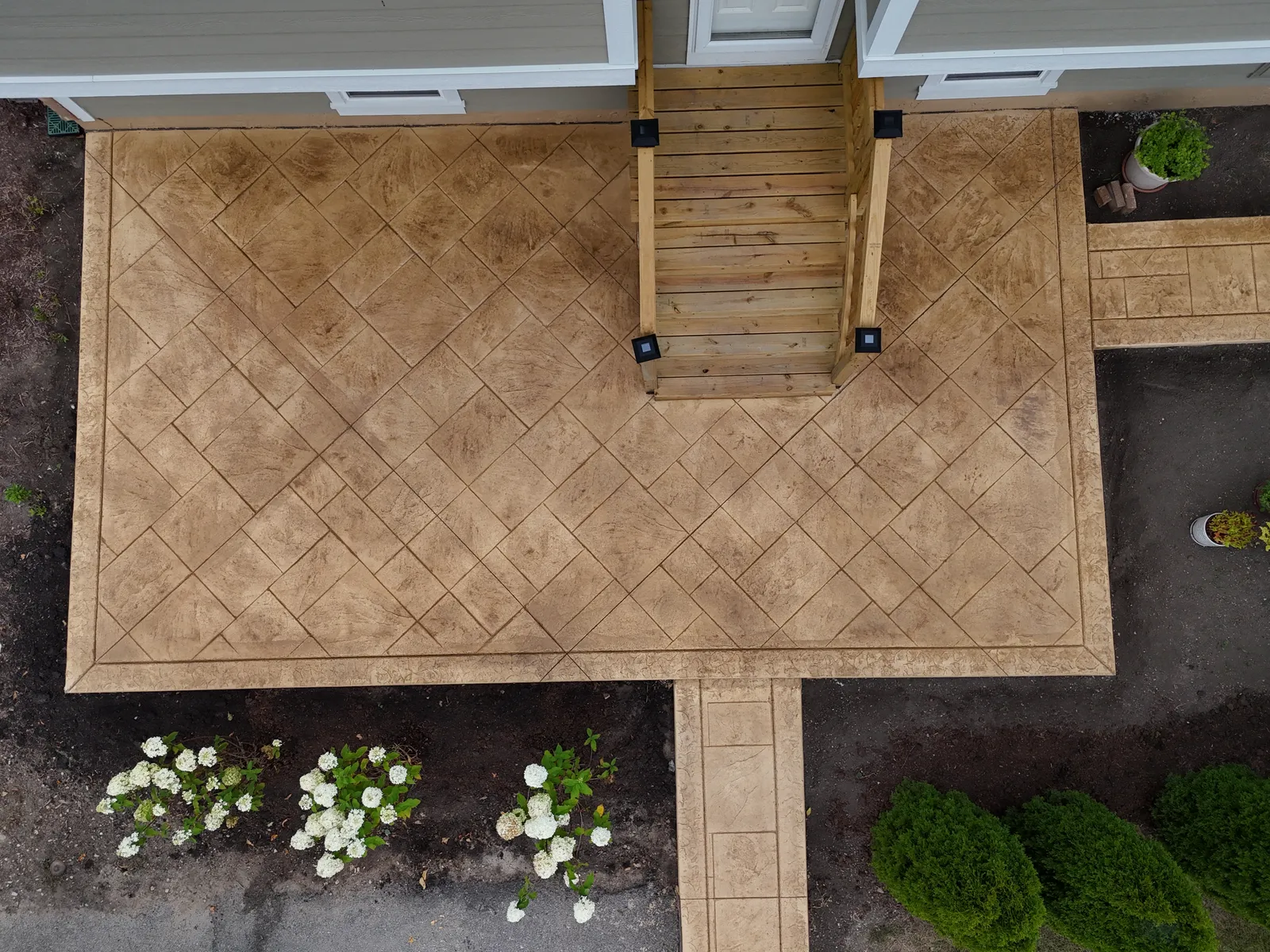 Stamped herringbone patio pattern — top-down overhead view
