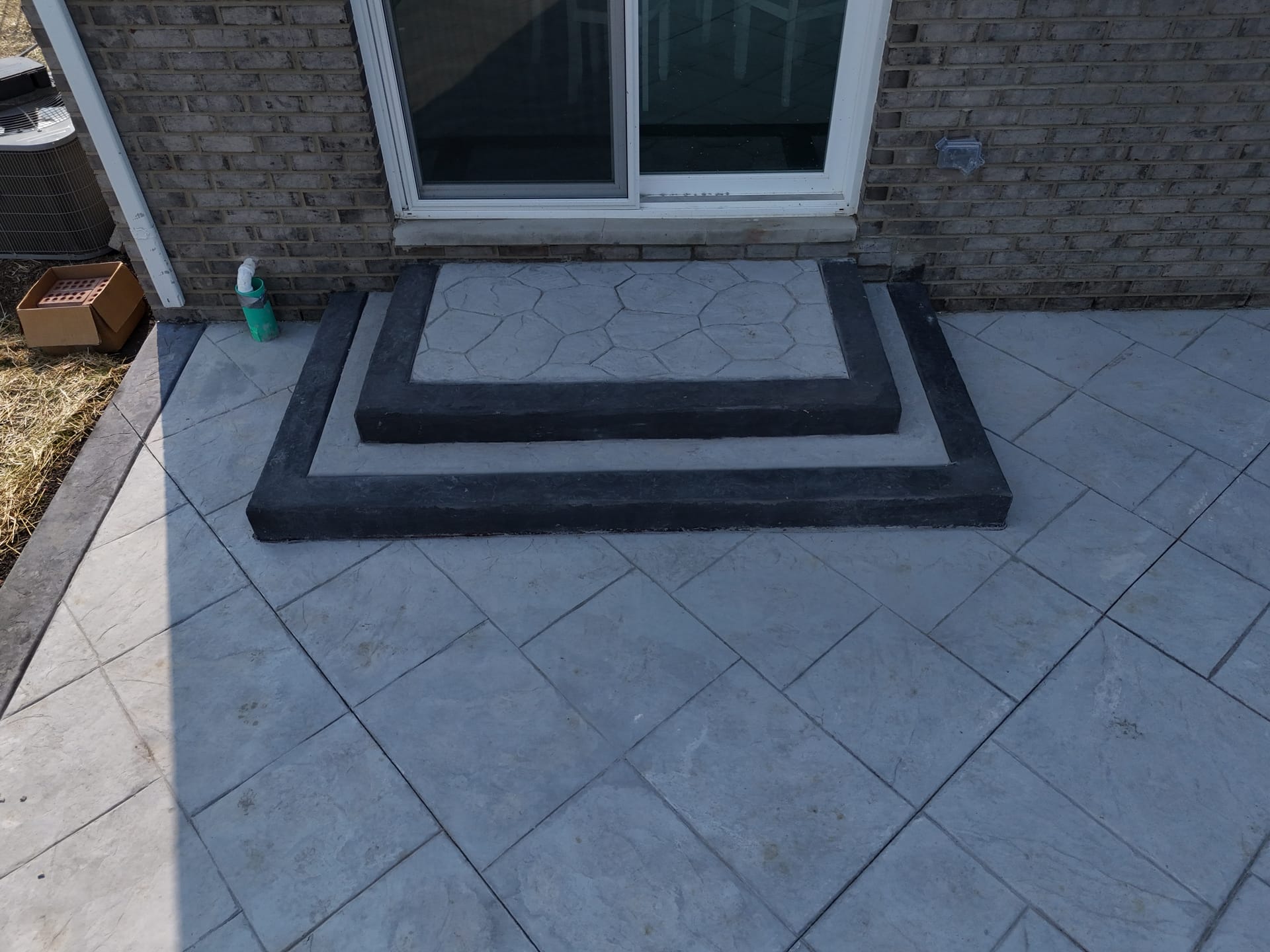 Stamped concrete patio with custom steps