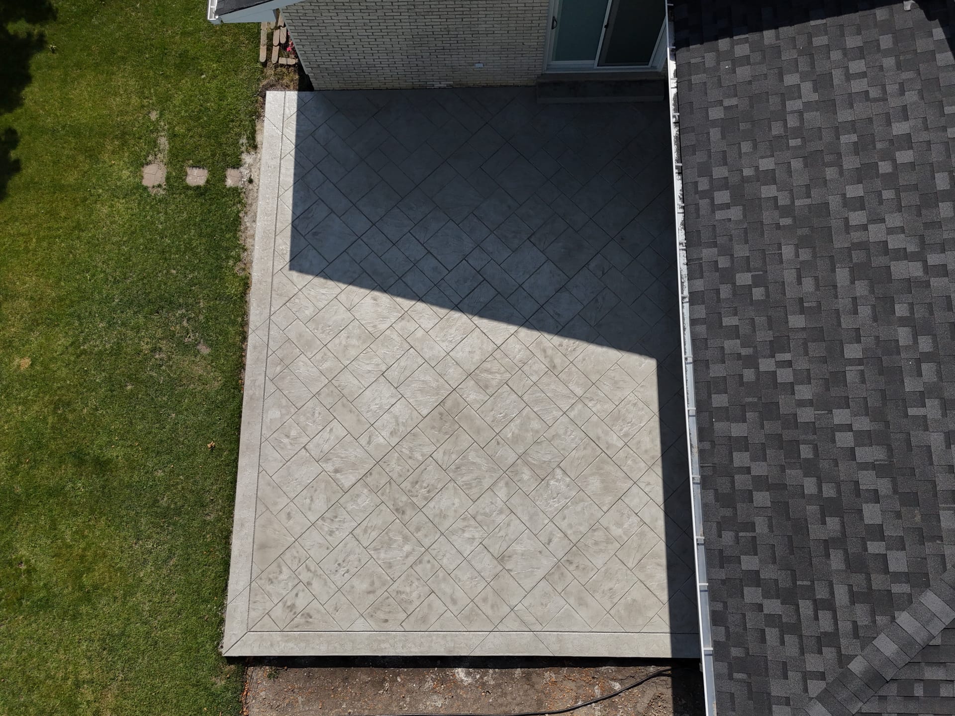 Two-tone stamped concrete patio aerial view