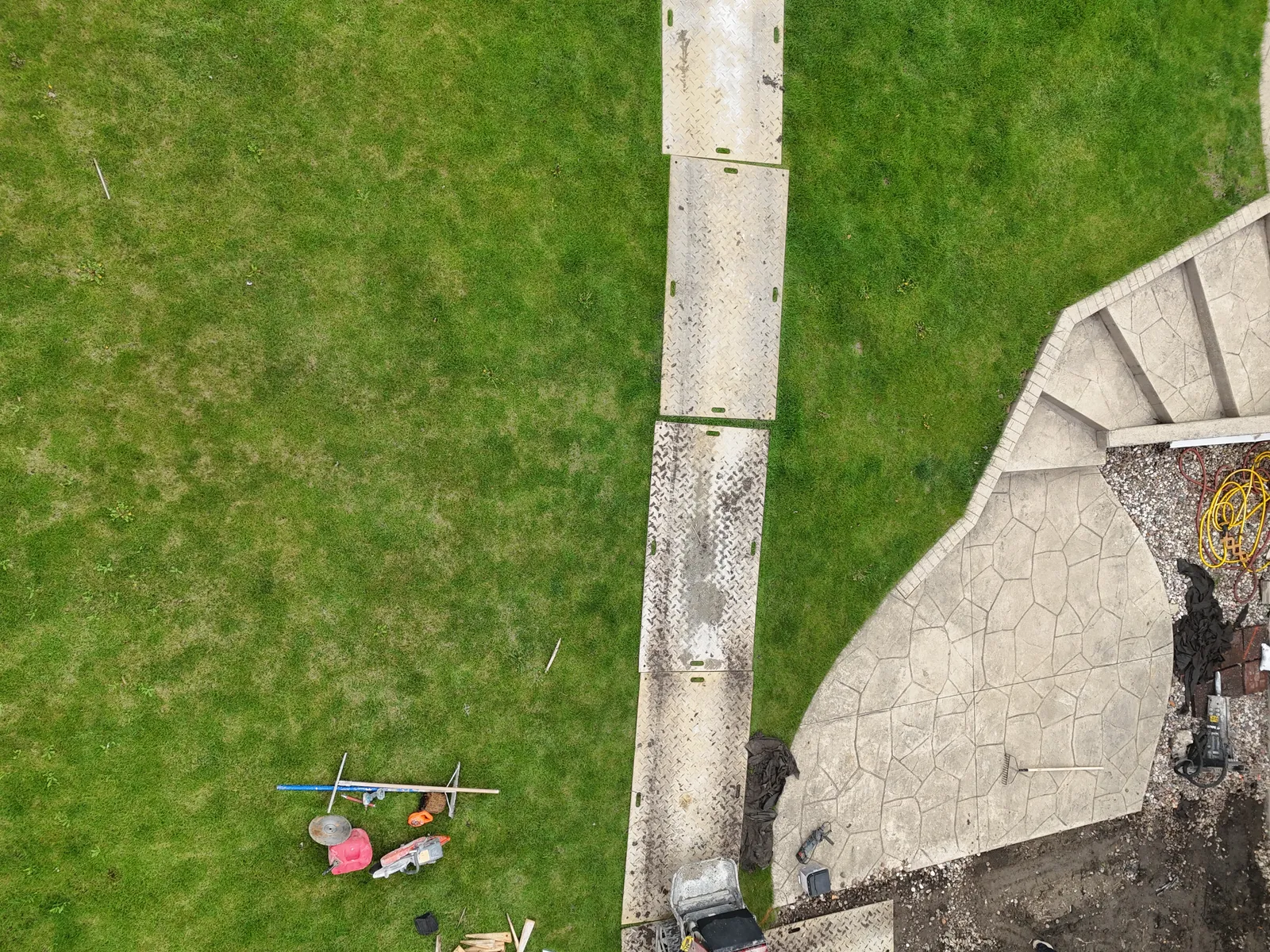 Stamped concrete patio and walkway with curved edge — aerial