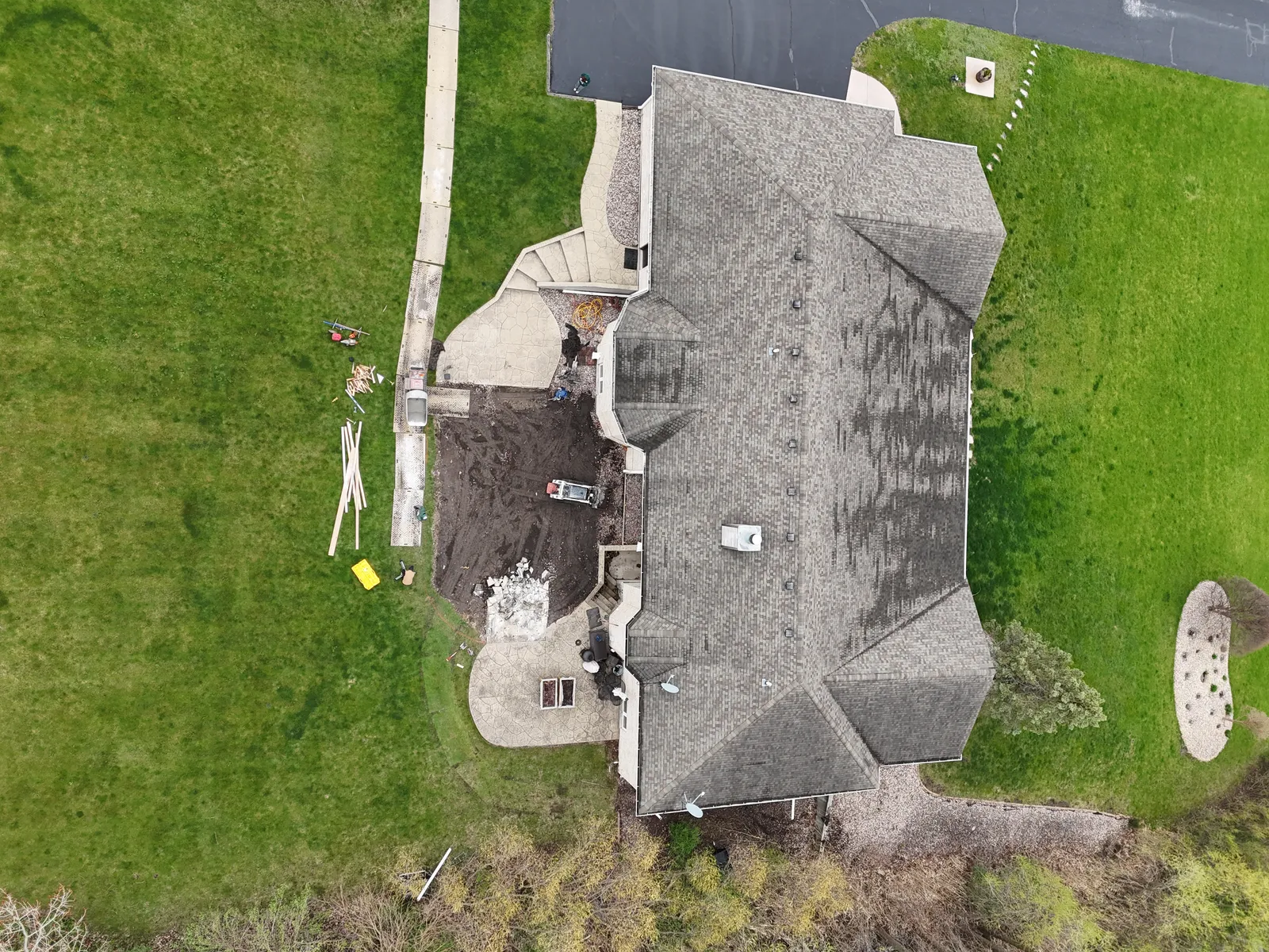 Stamped walkway and patio full property overview — aerial